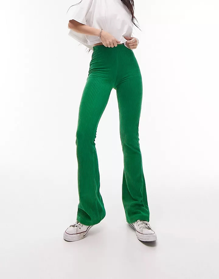 Pantalones de campana verdes elásticos de pana aterciop